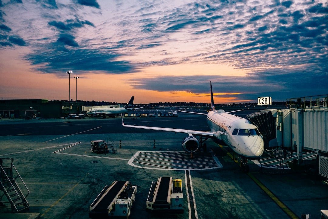 Traveler looking out across an airport runway